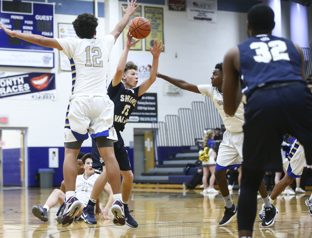 Spring Valley guard Ryan Frazier (15) makes a pass during a basketball game at Sierra Vista ...