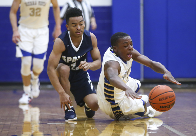 Sierra Vista guard Isaiah Veal (5) gets control of the ball over Spring Valley guard Elijah ...