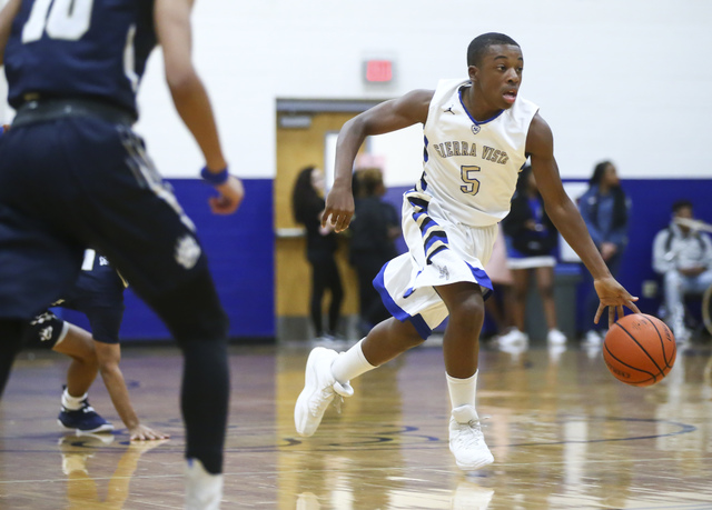 Sierra Vista guard Isaiah Veal (5) drives the ball against Spring Valley during a basketball ...