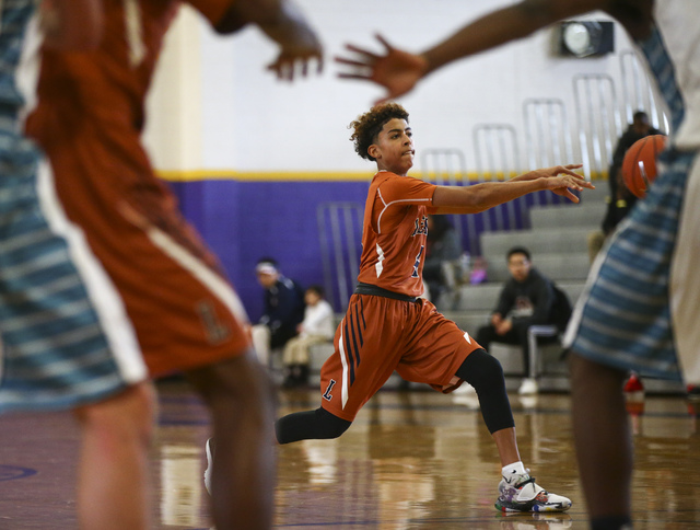 Legacy’s Jayvon Lewis (4) makes a pass during a basketball game against Silverado at D ...