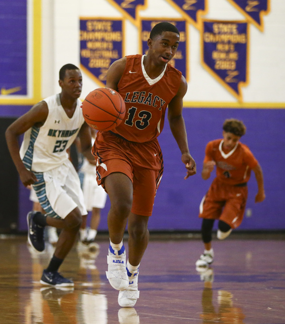Legacy’s Cristian Pitts (13) drives towards the basket during a basketball game agains ...