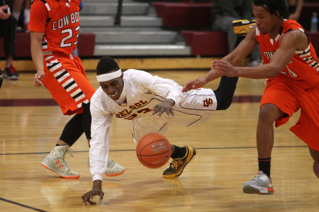 Del Sol forward Noah Spearman gets tripped up but retains control of the ball during a game ...
