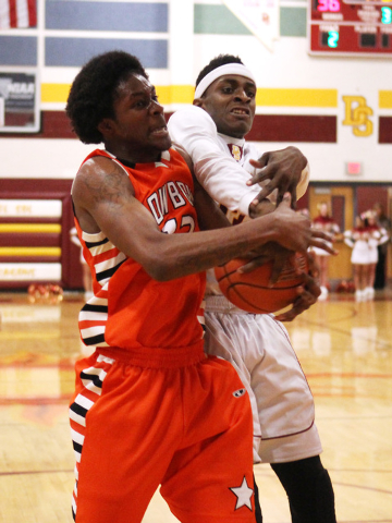 Chaparral center Maharie Trotter, left, and Del Sol forward Noah Spearman fight for a reboun ...