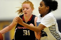Coronado guard Karlie Thorn (31) rushes the ball up court while being guarded by Canyon Spri ...