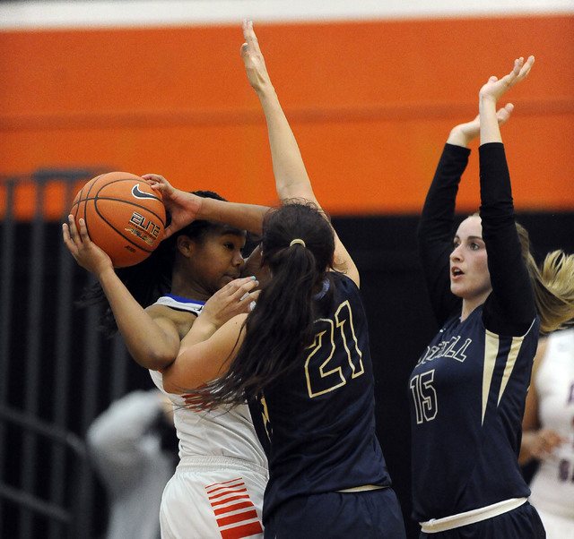 Bishop Gorman guard Skylar Jackson, left, looks to pass while Foothill’s Taylor Turney ...