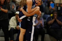 Centennial’s Teirra Hicks lifts teammate Tramina Jordan in celebration after the Bulld ...