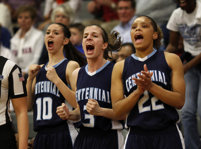 Centennial players, from right, Teirra Hicks, Ivana Ganeva and Courtney Walker, cheer on the ...