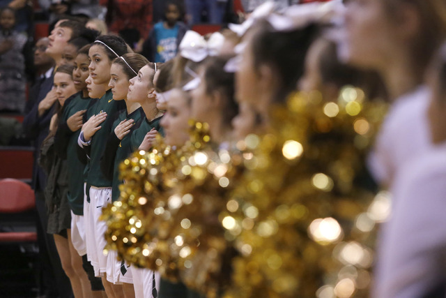 Bishop Manogue players stand for the Star-Spangled Banner before the first half of a Class 4 ...