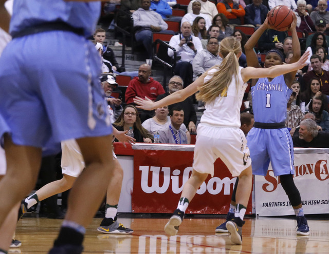 Centennial’s Pam Wilmore (1) looks for a pass during the first half of a Class 4A girl ...
