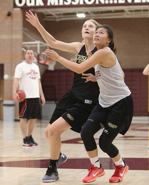 Faith Lutheran’s Madison Bryanna Neagle, left, and Madison Bocobo battle for the rebou ...