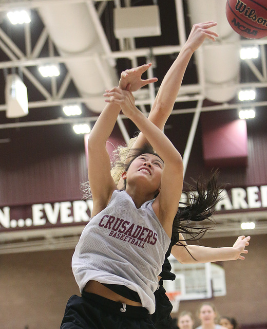 Faith Lutheran’s Madison Bocobo, left, and Bryanna Neagle, battle for the rebound duri ...