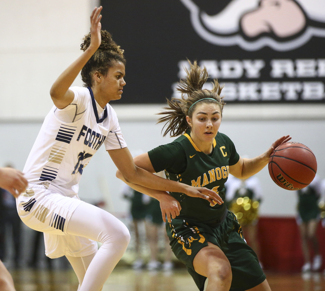 Bishop Manogue guard Malia Holt (5) drives against Foothill’s Rae Burrell (12) during ...