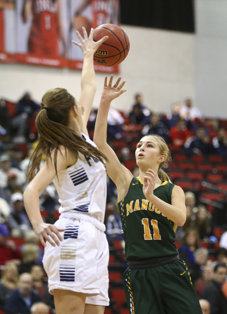 Bishop Manogue guard Kenna Holt (11) shoots over Foothill’s Aqui Williams (2) during t ...