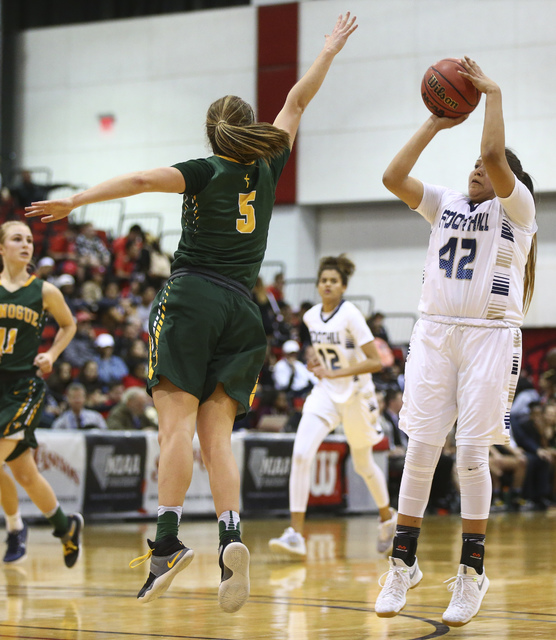 Foothill’s Trinity Betoney (42) shoots over Bishop Manogue guard Malia Holt (5) during ...