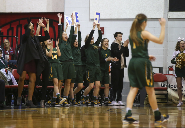 Bishop Manogue players cheer as they play Foothill during the Class 4A girls state basketbal ...