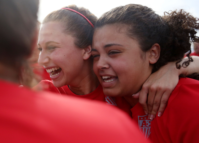 Arbor View’s Melanie Ara (13), center, celebrates with her teammates their victory aga ...