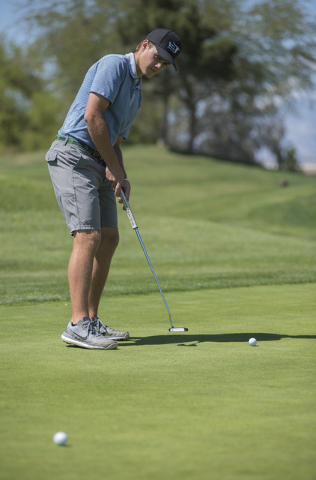 Shadow Ridge High School senior golfer Tanner Johnson practices at the Desert Golf Club in L ...