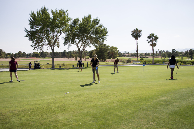 Faith Lutheran’s girls golf team practices at the Palm Valley Golf Course on Thursday, ...
