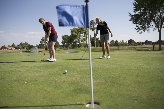 Faith Lutheran’s Olivia Vogel, 17, left and Sydney Smith, 16, practice at the Palm Val ...