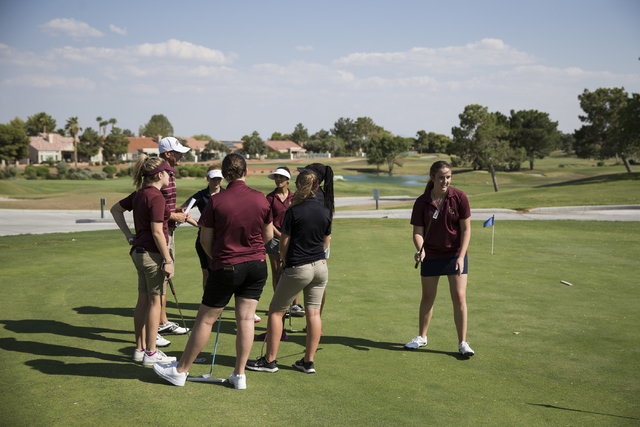 Faith Lutheran’s girls golf team including Olivia Vogel, 17, right, attend a team prac ...