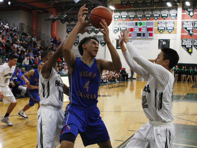 Bishop Gorman center Chase Jeter nearly loses the ball while being double teamed by Palo Ver ...