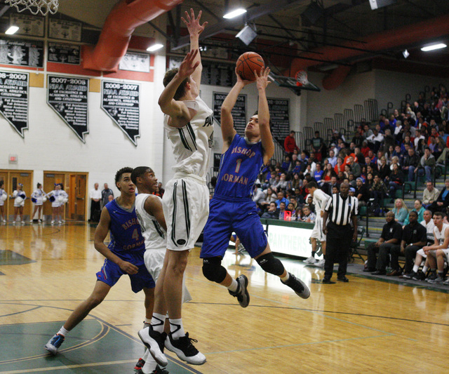 Bishop Gorman guard Chase Noma’aea is defended by Palo Verde forward Grant Dressler on ...