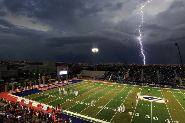 Lightning strikes over the Las Vegas valley as Bishop Gorman prepares to take on St. John Bo ...