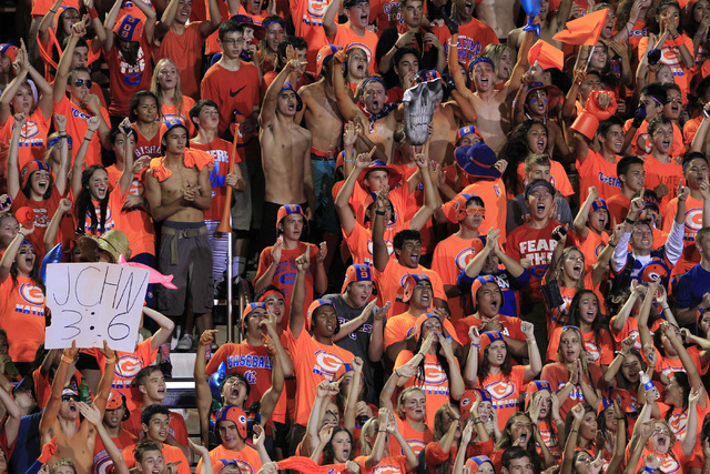 Bishop Gorman fans cheer after the Gaels scored against St. John Bosco during their game Fri ...
