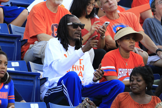 Snoop Dogg watches Bishop Gorman and St. John Bosco during their game Friday. The entertaine ...