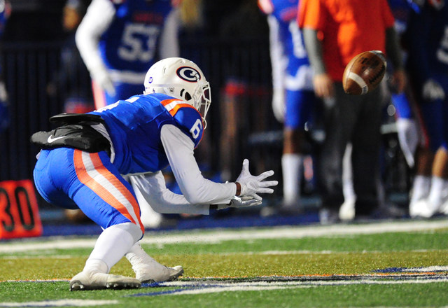 Bishop Gorman safety Austin Arnold catches a flea-flicker pass for a first down against Fait ...