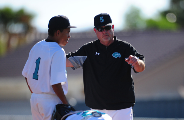 Silverado head coach Brian Whitaker removes pitcher Chandler Whitehead in the fourth inning ...
