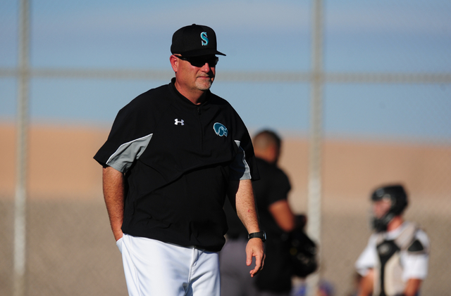 Silverado head coach Brian Whitaker walks to the dugout after making a pitching change in th ...