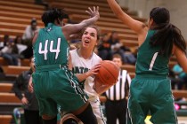 Green Valley guard Ellee Barton runs into Rancho guard LaKissa Martin during their game Tues ...