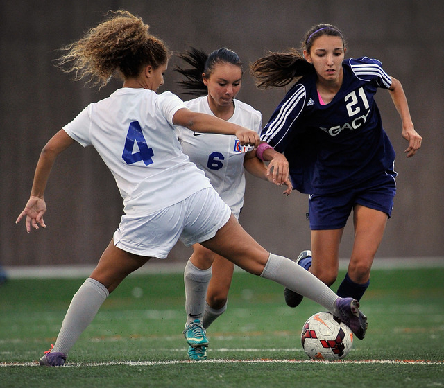Legacy High School’s Nadia Hernandez (21) is double teamed by Bishop Gorman’s Ad ...