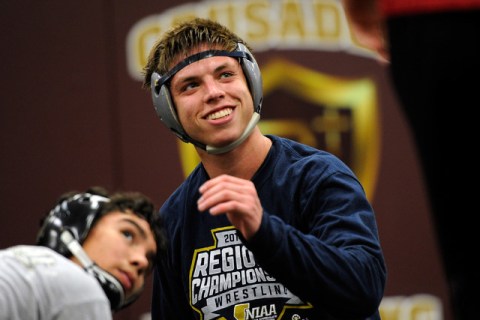 Faith Lutheran wrestler Owen Lawrie, left, smiles during a short break while grappling with ...