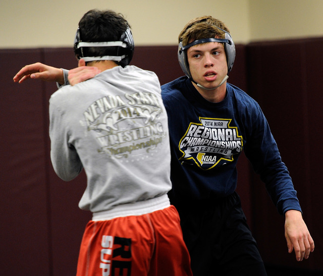 Faith Lutheran wrestler Owen Lawrie, right, grapples with teammate Hale Enos during practic. ...