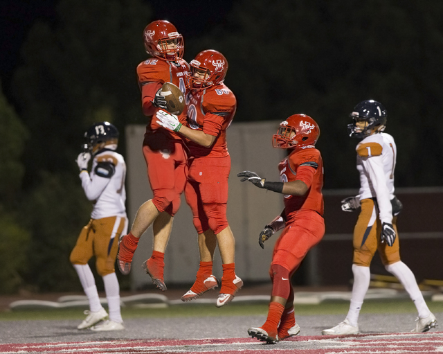 Arbor View’s Andrew Wagner (42) celebrates with Robert Linero (80) after scoring a fir ...