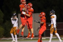 Arbor View’s Andrew Wagner (42) celebrates with Robert Linero (80) after scoring a fir ...