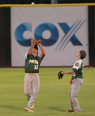 Rancho’s Juan Cruz-Sanchez (12) a popup as teammate Braulio Santiaguin (15) looks on d ...