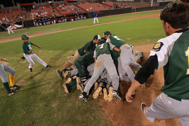 Rancho players celebrate after defeating the Las Vegas Titans 9-8 to win the American Legion ...