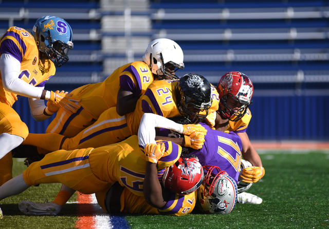 The Sunrise Region defense sacks Sunset quarterback Christian Tasi (17) during the Lions Clu ...