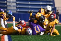 The Sunrise Region defense sacks Sunset quarterback Christian Tasi (17) during the Lions Clu ...