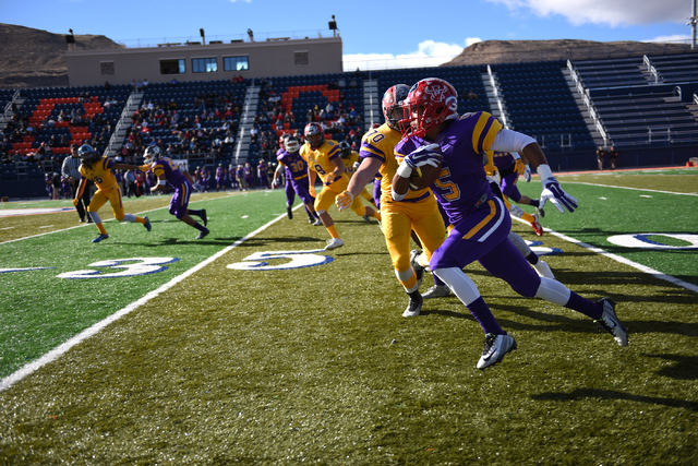 Sunset Region’s Maurice Harvey (5) runs past the Sunrise Region’s Josh Jurgensen ...