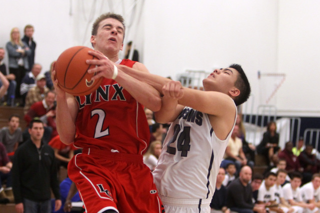 Lincoln County’s McClain O’Connor is fouled by The Meadows forward Michael Jin d ...