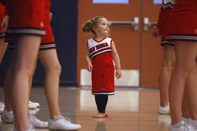 Alexis Harr looks for guidance from the Lincoln County cheerleaders while Lincoln County pla ...