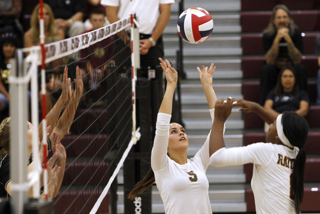 Mojave Girls Volleyball player RayEna Rael sets the ball for Kristina Gomez during their gam ...