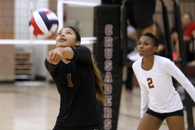 Mojave girls volleyball player Sierra Cummings passes a ball during their match against Fait ...
