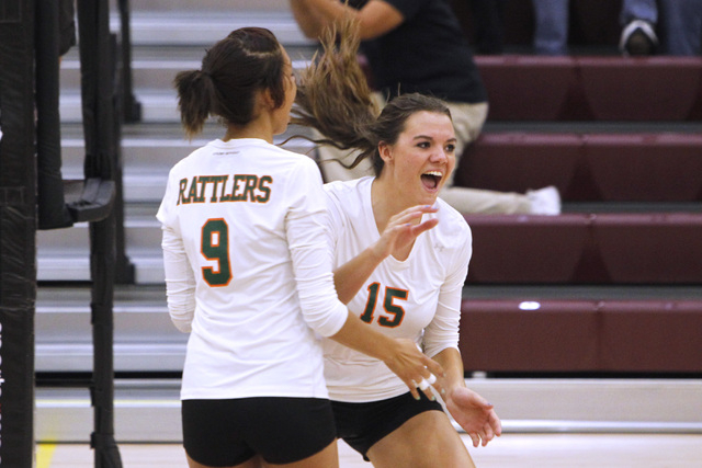 Mojave girls volleyball players Allison O’Neill, left, and Shyanne Orton celebrate a p ...