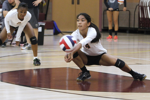 Mojave girls volleyball player Carissa Limtiaco digs a ball during their match against Faith ...
