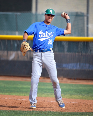 Green Valley first baseman Keola Paragas throws the ball back to the pitcher during a recent ...